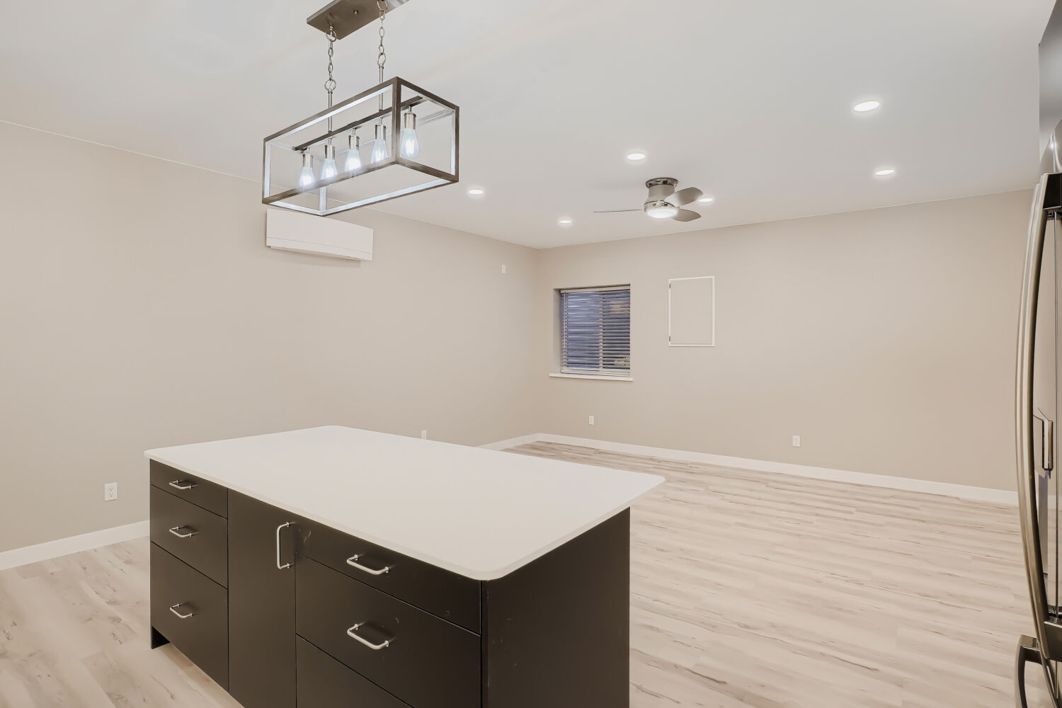 Basement great room, island view — 3590 West 21st Avenue Unit 2, Denver, CO 80211