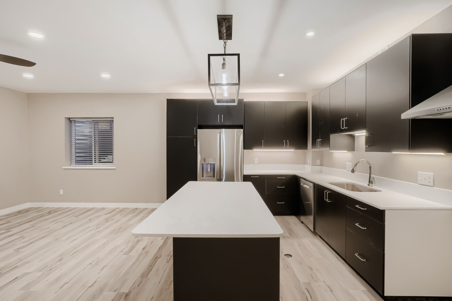 Basement great room, kitchen view — 3590 West 21st Avenue Unit 2, Denver, CO 80211